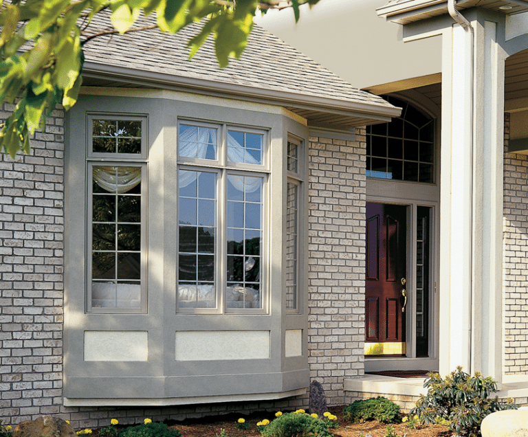 Example of bay windows set into a beige brick home
