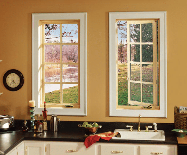 2 vertical casement type windows with white trim